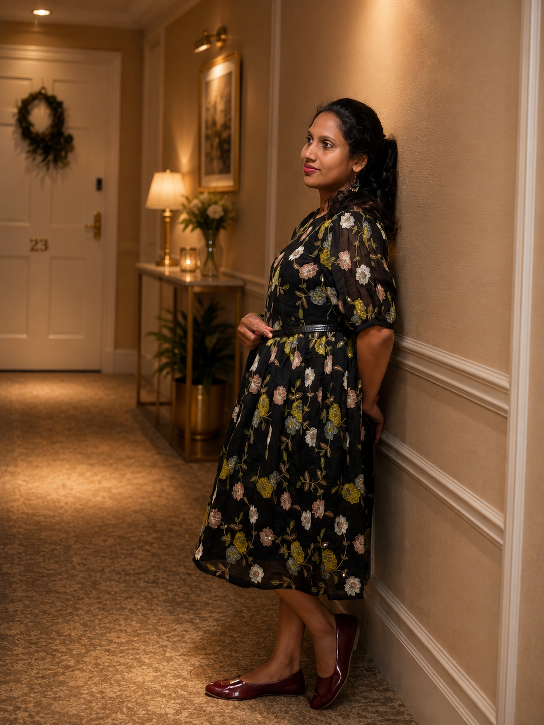 Black, knee-length frock with floral pattern